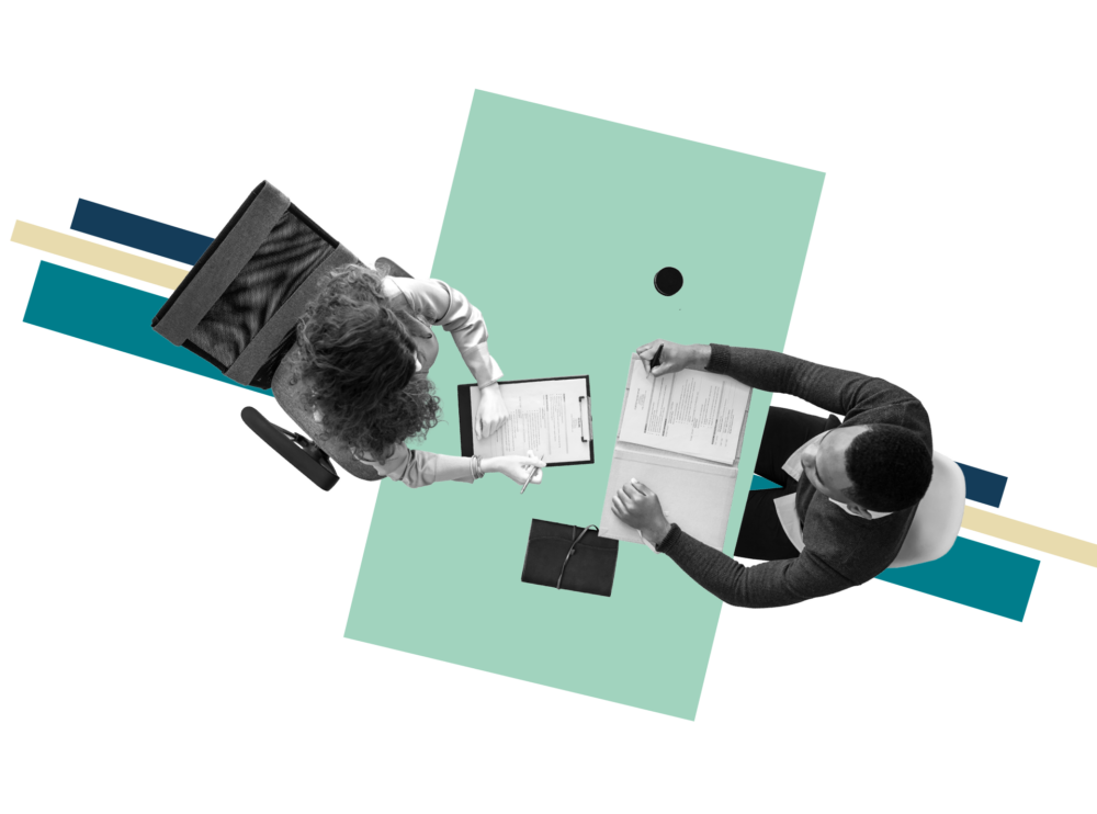 Overhead of two people looking over a document over abstract graphic.