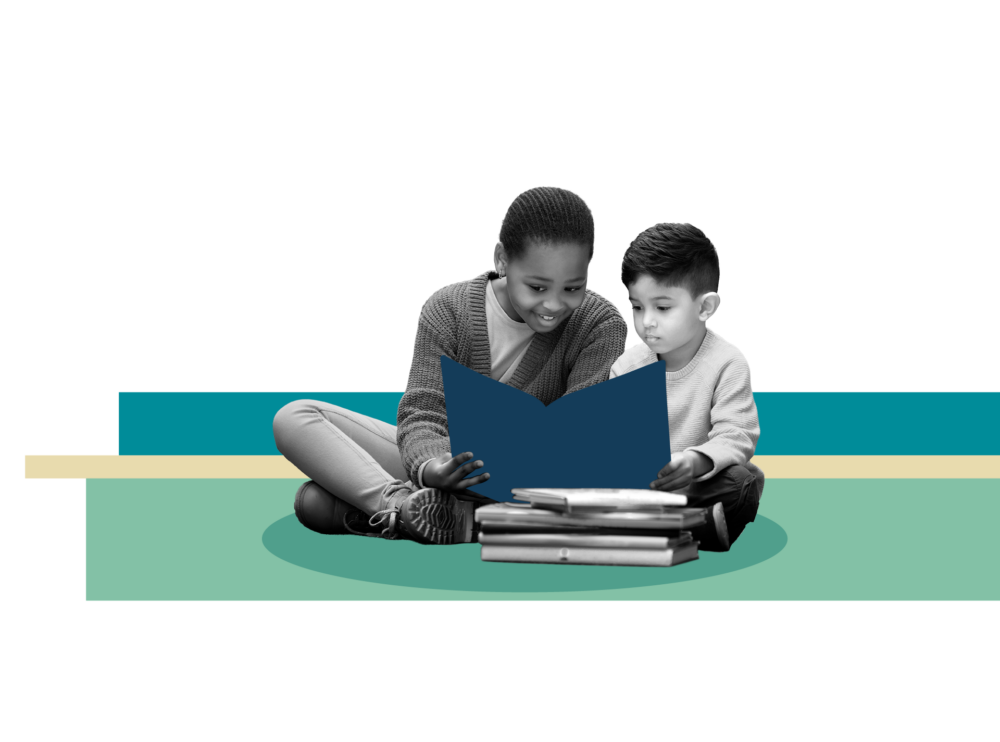 A black-and-white image of an older girl and a younger boy sitting cross-legged on the floor, reading a blue book together. They are positioned against an abstract background of teal, beige, and mint green horizontal blocks on a solid black field.